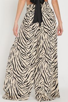 You'll be the coolest chick in the crowd with The Alex Zebra Print Wide Leg Trousers. Pair these with a fun graphic tee or simple top and heels. Wear them out to brunch, happy hour, a concert, to the office, date night, the options are endless! Details + Fit 100% Polyester Runs True to Size Hand Wash Cold Hang Dry High Waist Hook & Eye Closure Removable Waist Tie Side Pockets Wide Leg Zebra Print Design Beige | Black | Printed Model is 5'8" and wearing a size Small Wide Leg Pants Beige, Print Wide Leg Pants, Simple Top, Printed Wide Leg Pants, Cool Graphic Tees, Hook Eye, Wide Leg Trousers, Zebra Print, Waist Tie