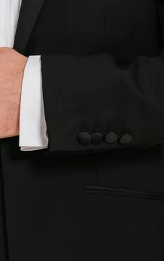 LUXURY TUXEDO PACKAGELuxury 100% Wool Notch Lapel Tuxedo, White Dress Shirt, Black Dress Shoes, Black Silk Cummerbund, Black Silk Bow Tie & FREE Suit Bag. Our most luxurious and classically designed notch lapel tuxedo is perfect for wearing all-year round. This 100% pure new wool tuxedo is our premium notch lapel tuxedo in our Dobell range and is tailored to the highest standard. Made from 100% pure wool, this tuxedo will not only keep you warm in the winter months but cool in the summer. The timelessly elegant tuxedo jacket features one button fastening, slanted jetted pockets and a fabric covered button cuffs. The half lined, precision cut trousers have been made to match. They have been designed with a flat front, feature side and rear pockets and are finished with a quarter inch satin Spring Fitted Tuxedo For Formal Occasions, Fitted Summer Tuxedo For Formal Occasions, Spring Formal Fitted Tuxedo, Elegant Fitted Summer Tuxedo, Luxury Tuxedo, 3 Piece Tuxedo, Tuxedo White, Wing Collar Shirt, Black Tie Tuxedo