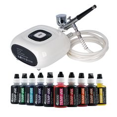 an electric tattoo machine with 12 colors of ink in front of it and six bottles next to it