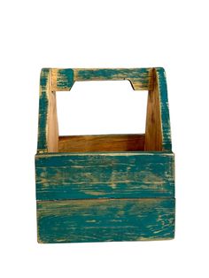 an old wooden box is painted green and yellow