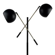 two black lamps sitting on top of a metal pole with one light on each side