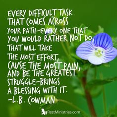 a blue flower sitting on top of a green leafy plant with a quote from j b rowan