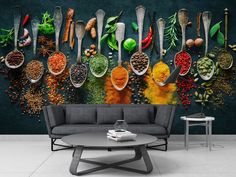 a wall mural with spices and herbs on it in a living room next to a chair