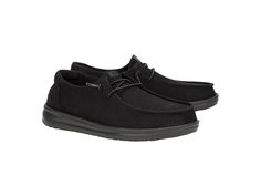 Hey Dude Wendy Work Wide - Women's Flat Shoes : Triple Black : Upgrade your footwear game choosing the Hey Dude Wendy Work Wide sneakers! Crafted with canvas upper and textile lining, these sneakers are as stylish as they are functional. The removable memory foam cushioned insole offers maximum comfort while preventing sweating and odors. Thanks to the Flex Fold technology, these sneakers support healthy feet by allowing complete freedom of movement. Slip-on style with an elasticized lace front. Branding on the tongue and back heel tab. Round toe design. Rubber outsole. Imported. Casual Slip-on Boots With Ortholite Insole, Wide Sneakers, Women's Flat Shoes, Hey Dude, Triple Black, Black 7, Toe Designs, Flat Shoes, Womens Flats