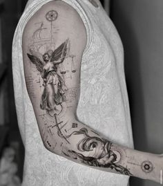 a man with a tattoo on his arm has a clock and angel tattooed on it