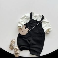 Introducing our Front Pocket Solid Overalls, the perfect choice for your little ones! 🌟 Made with high-quality cotton, these overalls are not only comfortable but also durable. The loose fit allows for easy movement, making them ideal for active kids aged 1-6. With a button-fly closure and solid pattern, these overalls are both stylish and practical. Whether it's playtime or a special occasion, these unisex overalls are sure to keep your child looking adorable. Shop now and give your little one Baby Overalls Boy Outfits, Baby Boy Korean Outfits, Unisex Overalls, Baby Beach Pictures, Overalls Baby Boy, Toddler & Baby Boy Style, Baby Boy Overalls, Child Clothes, Vintage Baby Boys