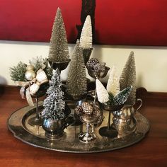 a tray with silver and white christmas trees on it