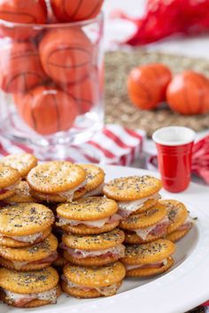 a white plate topped with crackers covered in cheese