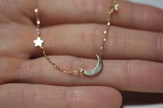 A shiny crescent moon & stars necklace in 14k or 18k gold. A beautiful anniversary gift for everyday wear and layering with your necklaces. Perfect gift for your mom for mother's day as well.
If you would prefer a custom necklace, please contact us before purchase.
Details The star pendants measure approx. 4 mm. The crescent moon measures approx. 12 mm. The necklace in the pictures is 18 inches long.
Material: 14k solid yellow gold, white gold, rose gold or 18k solid yellow gold, white gold, ros Gold Crescent Moon Necklace, Tiny Star Necklace, Moon Star Necklace, Crescent Moon Necklace Gold, Gold Crescent Moon, Anniversary Necklace, Star Necklace Gold, Crescent Necklace, Gold Necklace Simple