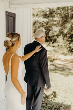 a bride and her father are getting ready to walk down the aisle