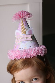 "Celebrate a magical birthday with a darling party hat! This hat in a Unicorn theme features beautiful pastels (pink, purple, aqua) and sparkly gold. Your child's name is featured in the center section of the hat. Party hats are made of heavyweight premium cardstock and trimmed with crepe-paper fringe. You may choose to add on ribbon trimmings and your child's name. (Last photo shows sample of different hat options) For the ties on the hat, choose satin ribbon ties (to be tied under child's chin Floral Party Decor, Paper Fringe, Easter Hat Parade, Floral Party Decorations, Unicorn Hat, Easter Hat, Magical Birthday, Birthday Unicorn, Hat Party