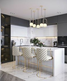 a modern kitchen with marble counter tops and bar stools