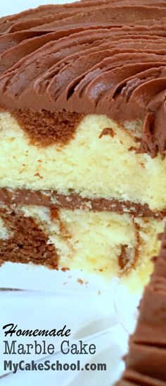 a close up of a cake with chocolate frosting on it's edges and one slice missing