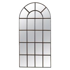 a large arched window with mirrors on the sides and an iron frame around it's edges