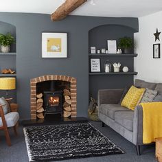 a living room filled with furniture and a fire place