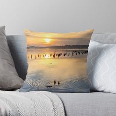 two ducks swimming in the water at sunset throw pillow by artbyorpho