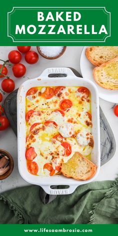 baked mozzarella in a white casserole dish with tomatoes and bread