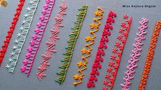 many different colored hair clips on a gray surface with the words miss alaska beginner written below them