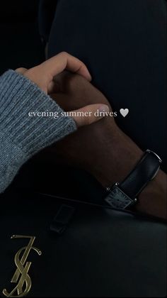 someone holding onto the arm of another person wearing a watch and bracelet that says evening summer drives