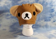 "Light Brown Base with White Mouth, Black Eyes/Nose and Tan Inner Ear 100% Machine Stitched, no GLUE or FELT! Handmade entirely out of super soft anti-pill fleece so it's washable! It measures 22\" around and will fit most adult/teen sized heads. This hat is also available in children's and XL sizes for no additional cost. We do custom orders too, send your ideas to us for a quote!" Old Halloween Costumes, Felt Handmade, Inner Ear, Bunny Hat, Bear Hat, Dog Hat, Black Eyes, Skull Cap Beanie, Brown Bear