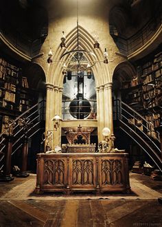 an old library with many bookshelves and stairs