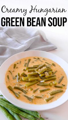 creamy hungarian green bean soup in a white bowl