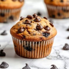 chocolate chip muffins on a marble surface