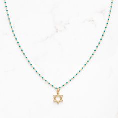 "Dainty Star of David necklace on sterling and gold plated, enamel beaded chain.  Adjustable 16-18\"	in stock	45.00 USD	"	4.00 USD	Jewelry > Necklaces > Charm Necklaces
"	top_seller_high	false	https://www.etsy.com/listing/1584979972/star-of-david-magen-david-necklace-for	adult	etsy://listing/1584979972?ref=applinks_android	stitchandstonedesign	Black	new	en-US	"	false	unisex	0.67	Apparel & Accessories > Jewelry > Necklaces	https://i.etsystatic.com/6649757/r/il/b16bbe/5451198694/il_fullxfull.54511 Star-shaped Beaded Chain Necklace For Gift, Gold Necklaces With Star Charm And Round Beads, Gold Necklace With Star Charm And Round Beads, Star-shaped Jewelry With Beaded Chain For Gifts, Magen David Necklace, Star Of David Necklace, Necklace Top, Enamel Beads, Studded Necklace