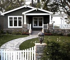 a house with a white picket fence around it