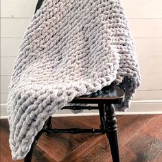 a chair with a blanket on top of it