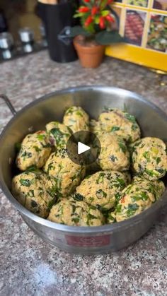 a pan filled with food sitting on top of a counter