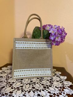 Burlap jute tote bag with handles. Laminated interior. 12X12X7.8inch.Sturdy, waterproof. Rectangular Cream Jute Bag, Rectangular Cream Jute Bags, Beige Rectangular Canvas Bag With Reinforced Handles, Artisan Rectangular Jute Bag, Cream Rectangular Jute Bag, Rectangular Beige Burlap Beach Bag, Beige Rectangular Jute Beach Bag, Beige Rectangular Jute Canvas Bag, Beige Burlap Rectangular Beach Bag