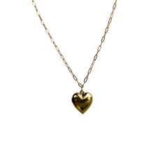 This sweet, timeless necklace features our puffy heart charm on our medium cable chain. Tarnishing is a bummer, so we plate our jewelry in a luxuriously-thick layer of gold for extra longevity. The 18" chain is lightweight, strong, and can be clasped anywhere for various lengths. Assembled in our Charleston, SC studio. **If you want a similar necklace with multiple charms, please click here to build your custom necklace.** CARE: Gold-plated brass chain. Made in the U.S.A. Hart proudly plates her Adjustable Chain Charm Necklace For Valentine's Day, Everyday Adjustable Charm Necklace For Valentine's Day, Dainty Heart Pendant Charm Necklace With Cable Chain, Valentine's Day Charm Necklace With Cable Chain, Dainty Heart-shaped Charm Necklace With Cable Chain, 14k Gold Heart Charm Necklaces With Adjustable Chain, 14k Gold Heart Charm Necklace With Adjustable Chain, Everyday Gold Heart Necklace With Cable Chain, Everyday Yellow Gold Heart Necklace With Cable Chain