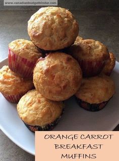 orange carrot breakfast muffins on a plate with the words orange carrot breakfast muffins