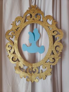 a gold frame with a silhouette of a woman