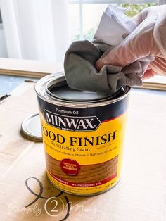 a can of minwax wood finish sitting on top of a table