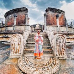 a woman standing in front of some steps