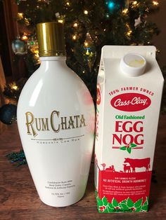 a bottle of rumchata next to a carton of egg nog on a table