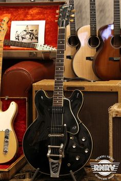 guitars and amps are on display at a music store