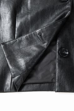 Experience the Excellence: Beyond Just Leather This cropped black faux leather blazer effortlessly combines practicality with versatile style, allowing wearers to express a unique personality through fashion. Its design accentuates body proportions brilliantly, while the glossy finish adds depth and contrast, embodying a cool, edgy vibe. The granular texture is not only smooth and refined but also offers a clear pattern, delivering a tactile experience that reveals the weight and quality of the Black Faux Leather Jacket With Buttons, Black Leather Cropped Jacket For Night Out, Trendy Faux Leather Jacket For Business, Black Faux Leather Blazer For Formal Occasions, Winter Work Faux Leather Cropped Jacket, Black Leather Jacket With Buttons For Night Out, Winter Workwear Faux Leather Cropped Jacket, Winter Workwear Cropped Faux Leather Jacket, Chic Black Leather Jacket For Business Casual