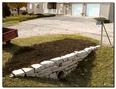 a pile of dirt sitting in the middle of a yard