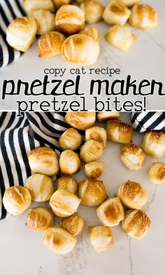 the pretzel makes pretzel bites on a marble counter top with black and white striped napkins