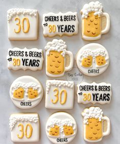 decorated cookies for 30th birthday with beer and cheeses on them that say cheers and beers 30 years