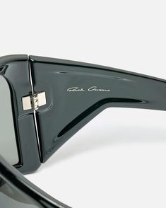 Rick Owens Kriester Glasses in Black/Black. These sunglasses feature a shield style frame, tonal black lens, integrated nose pads and offers 100% UV protection. The Kriester glasses includes a leather case with microfiber cloth. Formal Black Shield Sunglasses With Tinted Lenses, Formal Black Tinted Shield Sunglasses, Black Shield Sunglasses With Uva Protection For Formal Occasions, Formal Black Shield Sunglasses With Uva Protection, Modern Polarized Shield Sunglasses For Formal Occasions, Modern Shield Sunglasses With Mirrored Lenses For Formal Occasions, Sleek Formal Shield Sunglasses With Mirrored Lenses, Product Composition, Rick Owens Men