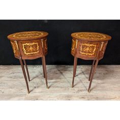 pair of side tables in the style of louis ii with marqueted drawers and gold leaf decoration