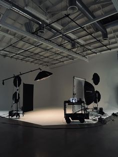 an empty photo studio with lighting equipment