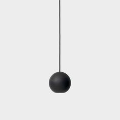 a black ball hanging from the ceiling