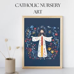 a painting with the words catholic nursery art in front of it and a vase with flowers