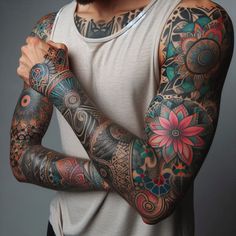 a man with many tattoos on his arms