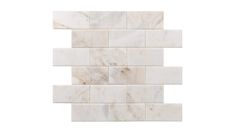 a white marble mosaic tile wall